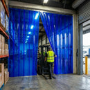 Transparent Blue PVC Strip Curtains installed on warehouse loading bay – Forklift operator walking through blue transparent strips, Hook-On stainless steel rail system for industrial use